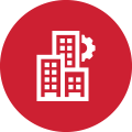 Red circular icon featuring a white building and a gear, representing a Building Management System (BMS).